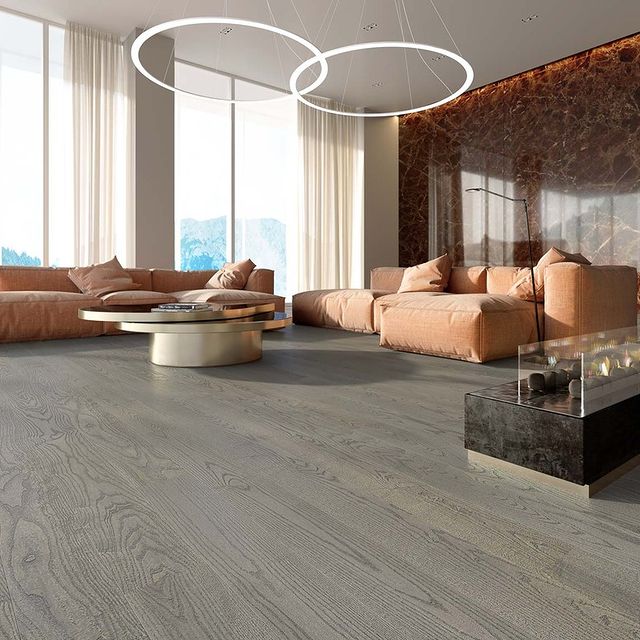 The silver coloured hardwood flooring balances the interior perfectly.